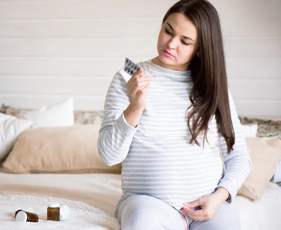 A pregnant woman is going to use folic acid.